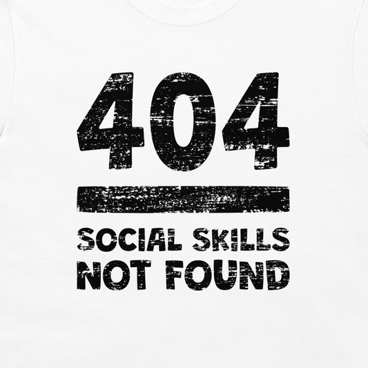 White t-shirt featuring a distressed black graphic print that reads '404 SOCIAL SKILLS NOT FOUND'.