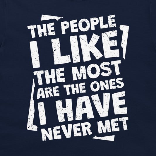 A close-up of a navy blue t-shirt, featuring a distressed white typographic print that reads 'THE PEOPLE I LIKE THE MOST ARE THE ONES I HAVE NEVER MET'.