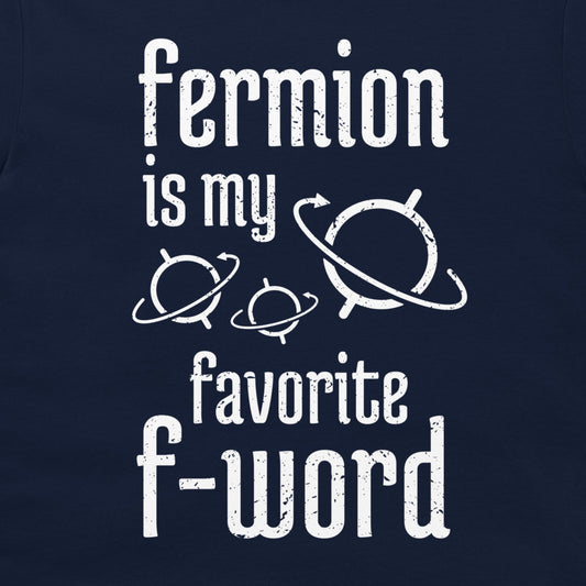 A dark navy blue graphic print on a t-shirt featuring the text 'fermion is my favorite f-word' in a distressed white font, accompanied by simple white orbital planet illustrations.