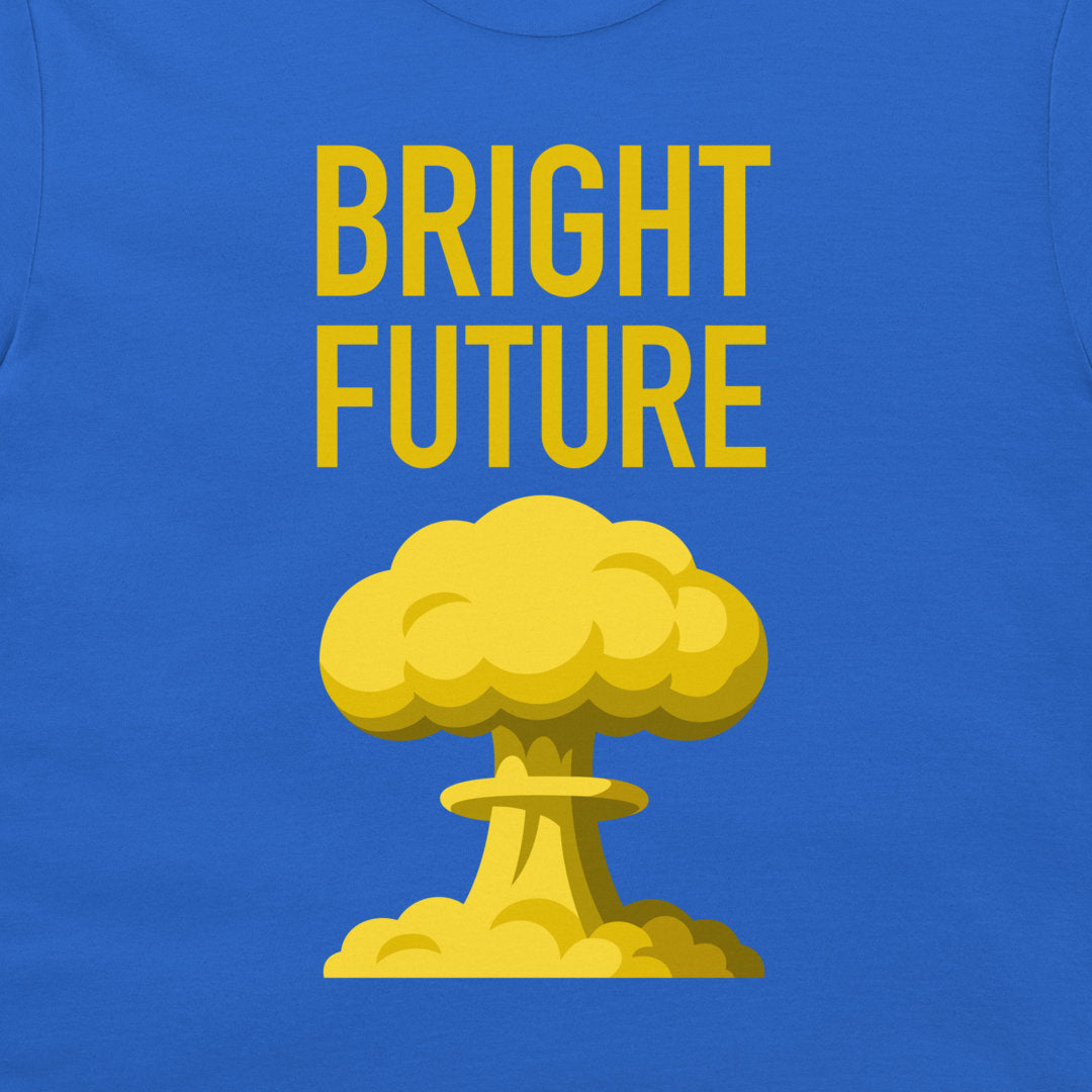A close-up of a royal blue t-shirt, featuring a bold yellow graphic print that reads 'BRIGHT FUTURE' above a cartoon-style mushroom cloud.