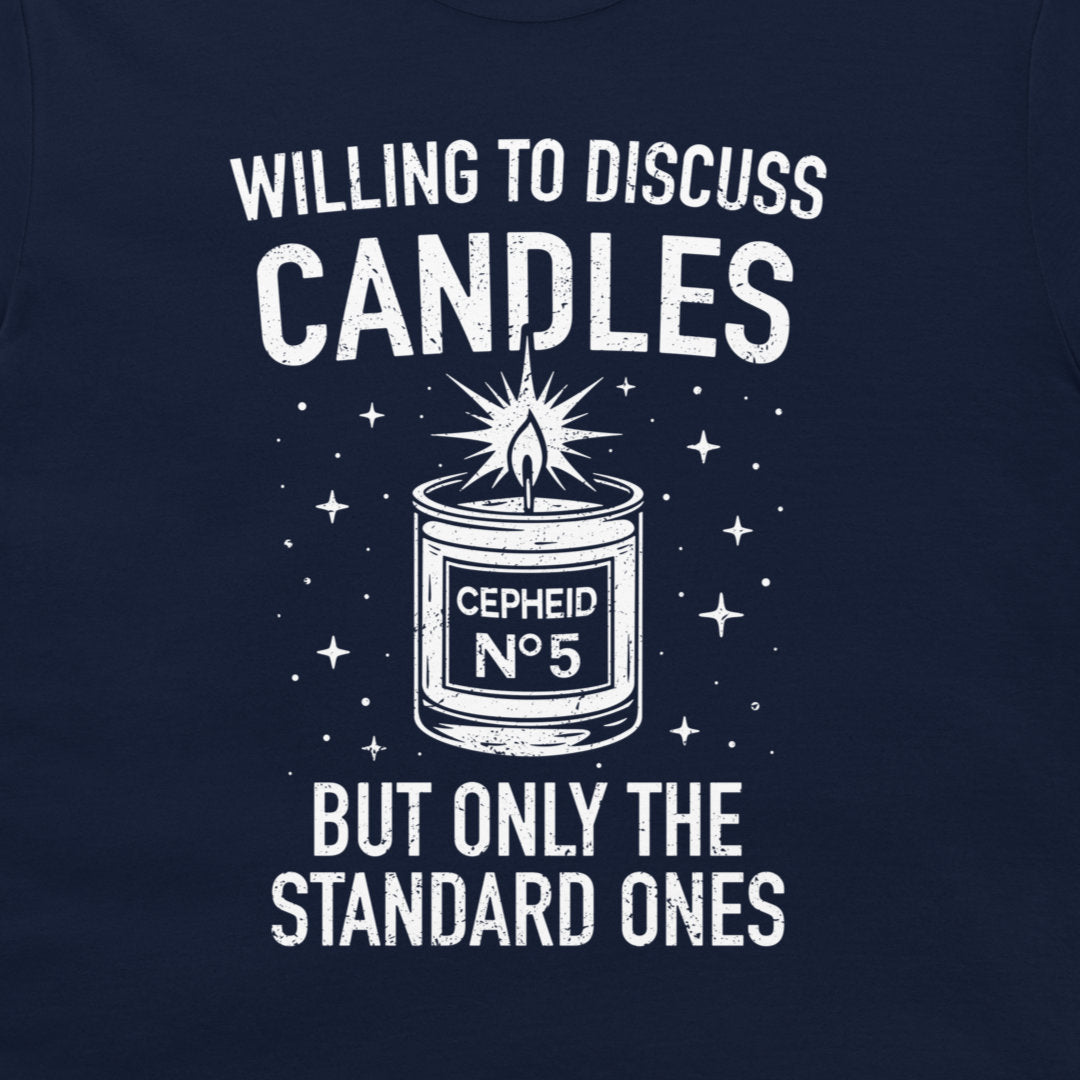 A close-up of a navy blue t-shirt featuring a white graphic print. The design displays a candle labeled 'CEPHEID No 5' with a starburst flame, surrounded by stars, with the text 'WILLING TO DISCUSS CANDLES BUT ONLY THE STANDARD ONES'.