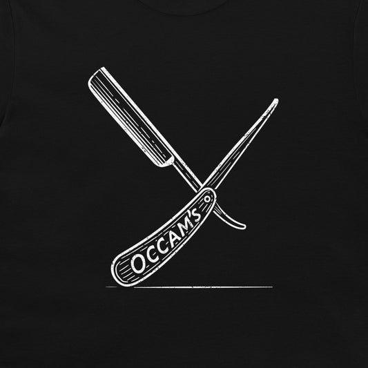 A close-up of a black garment, likely a t-shirt, featuring a white graphic print of two crossed folding knives with the word 'OCCAMS' on the handle.