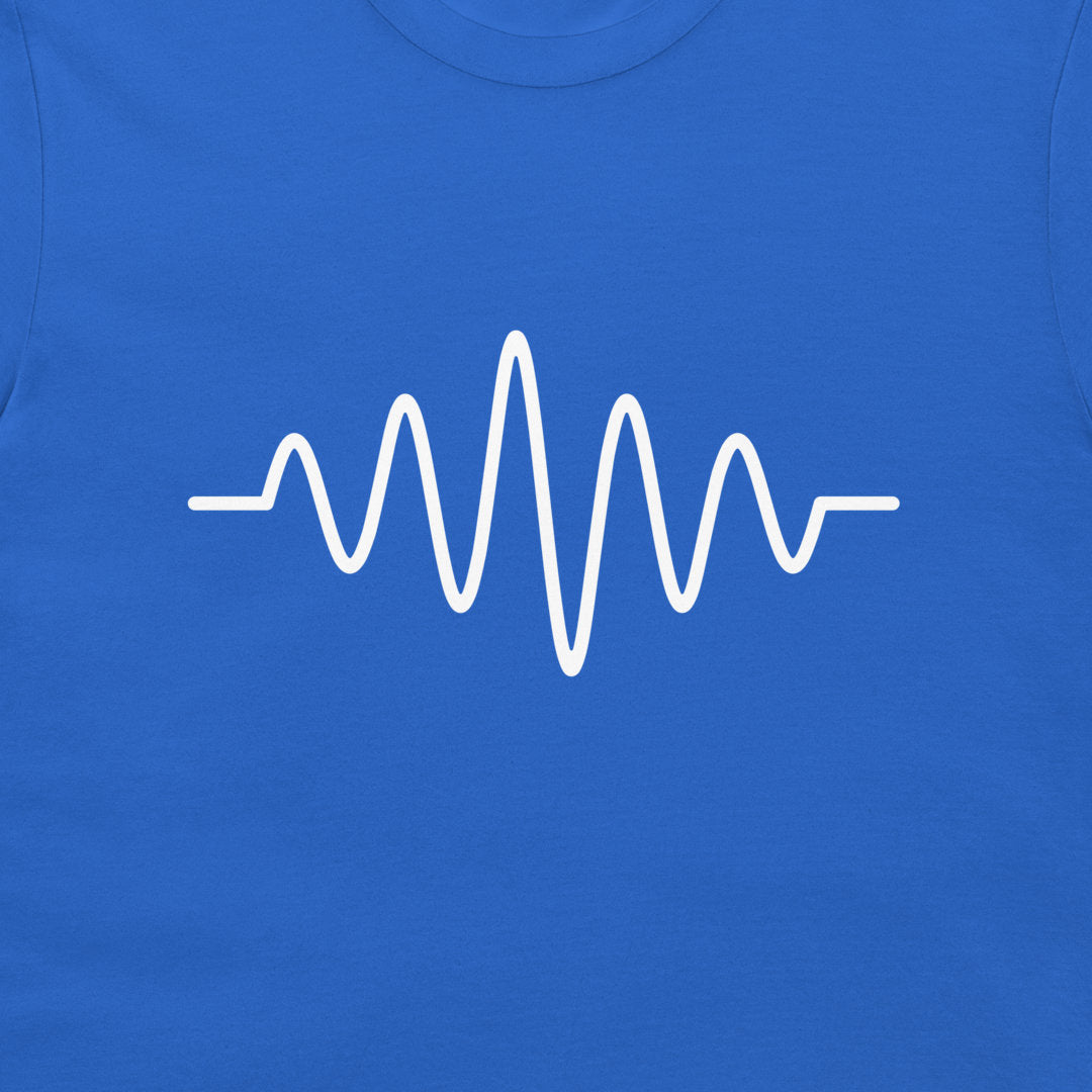 A close-up of a royal blue t-shirt featuring a white minimalist soundwave graphic printed across the chest.