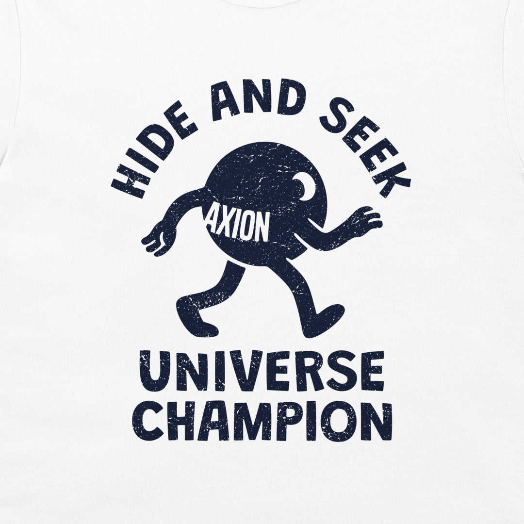 A close-up of a white t-shirt, featuring a distressed navy blue graphic print. The design shows a cartoon character with the word 'AXION' on its chest, surrounded by the text 'HIDE AND SEEK' above and 'UNIVERSE CHAMPION' below.
