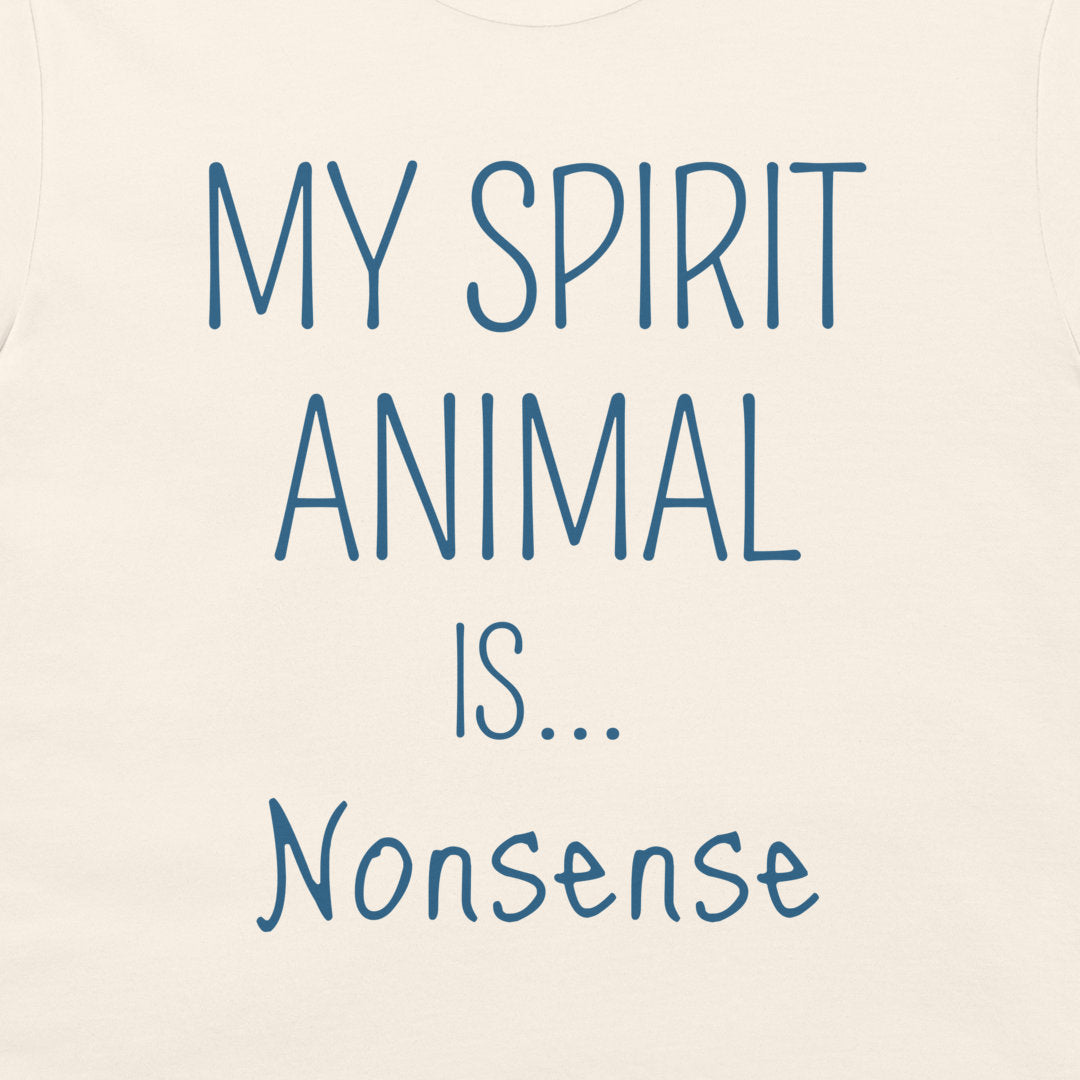 A close-up of a cream-colored t-shirt featuring the text 'MY SPIRIT ANIMAL IS.