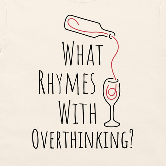 An off-white t-shirt featuring a humorous graphic print with the text 'WHAT RHYMES WITH OVERTHINKING?' in a black hand-drawn font. Above the text, a simple black line drawing shows a bottle pouring a red liquid into a wine glass, which has a red swirl inside.