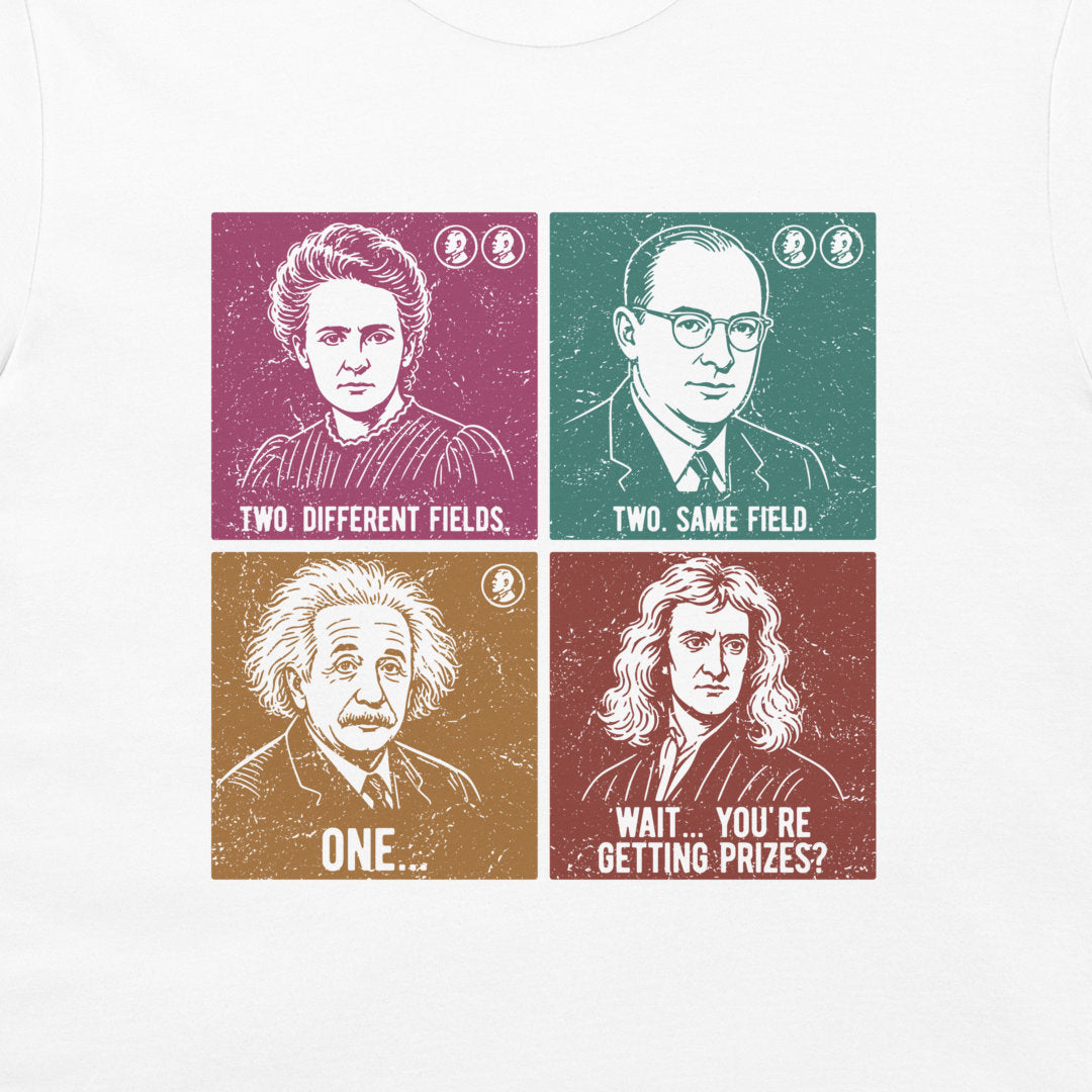 A white long-sleeve t-shirt featuring a graphic print of four famous scientists in a vintage pop-art style. The portraits are arranged in a 2x2 grid with humorous text labels: Marie Curie ('Two Different Fields'), Albert Einstein ('One.