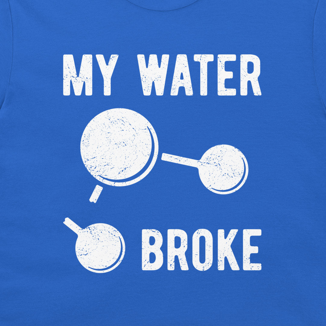 A close-up of a royal blue t-shirt featuring a distressed graphic print that reads 'MY WATER BROKE' with a broken water molecule illustration in white.