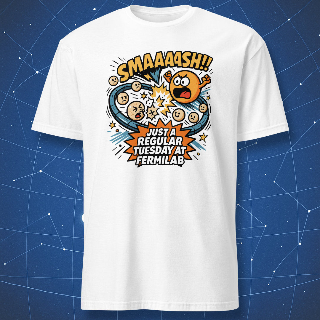 White T-shirt with bold cartoon-style atoms smashing together and text “SMAAASH!! Just a regular Tuesday at Fermilab” — funny science geek gift.
