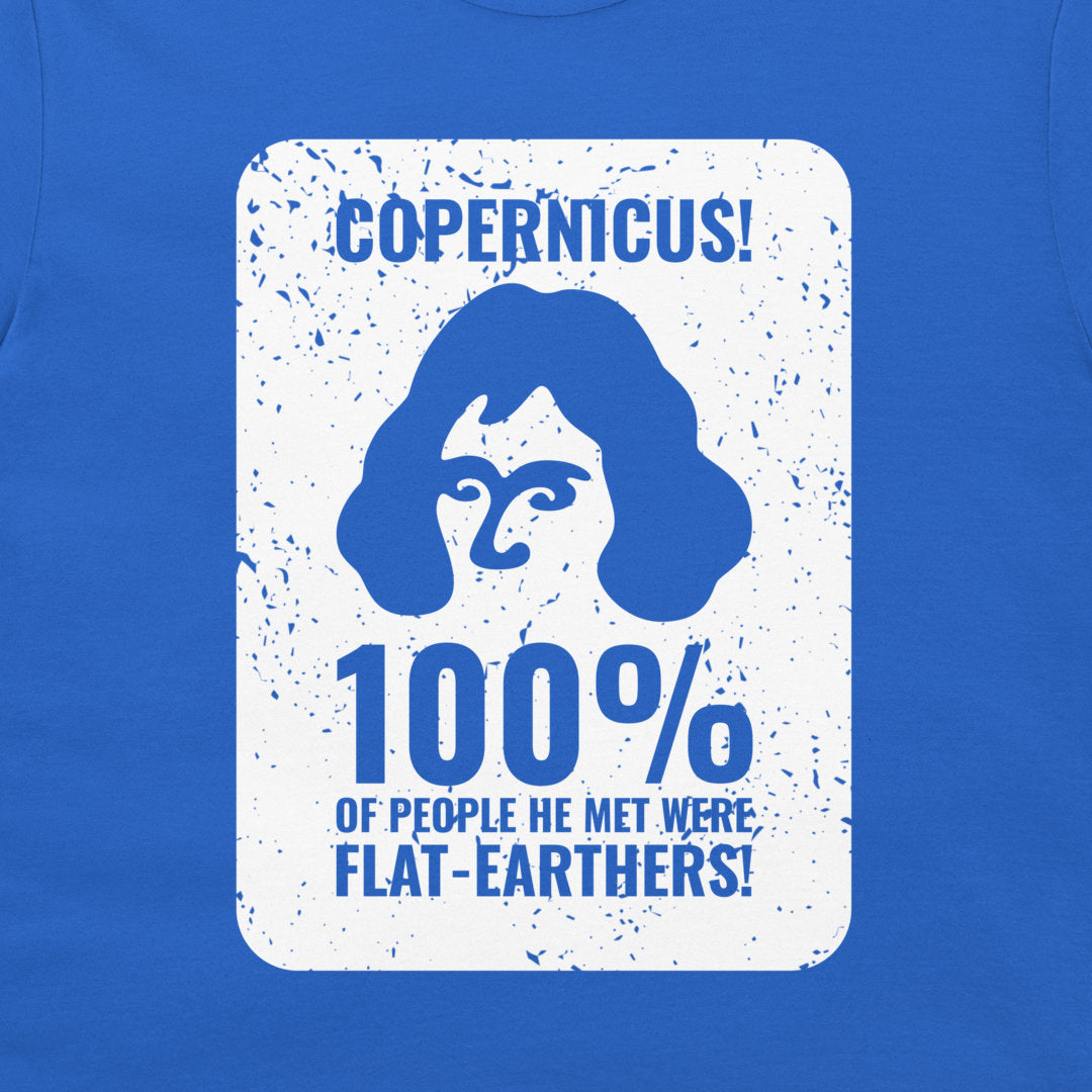 A close-up of a blue garment, likely a t-shirt, featuring a large white rectangular graphic print with a distressed design. The graphic displays a blue silhouette of Copernicus with the text 'COPERNICUS! 100% OF PEOPLE HE MET WERE FLAT-EARTHERS!' in blue lettering.