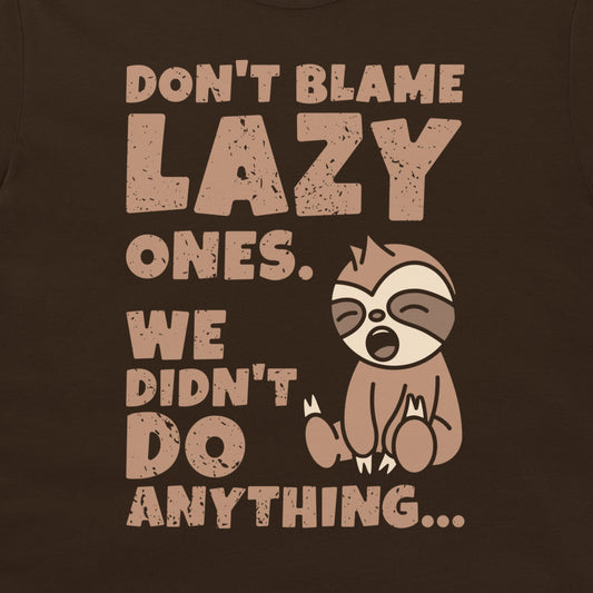 A dark chocolate graphic t-shirt featuring a distressed beige print that reads 'DON'T BLAME LAZY ONES. WE DIDN'T DO ANYTHING.