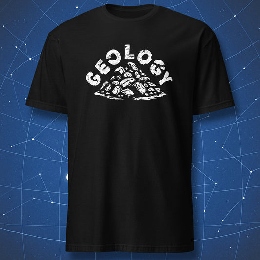 funny geology T-shirt on black background with white text “Geology” above a pile of rocks illustration