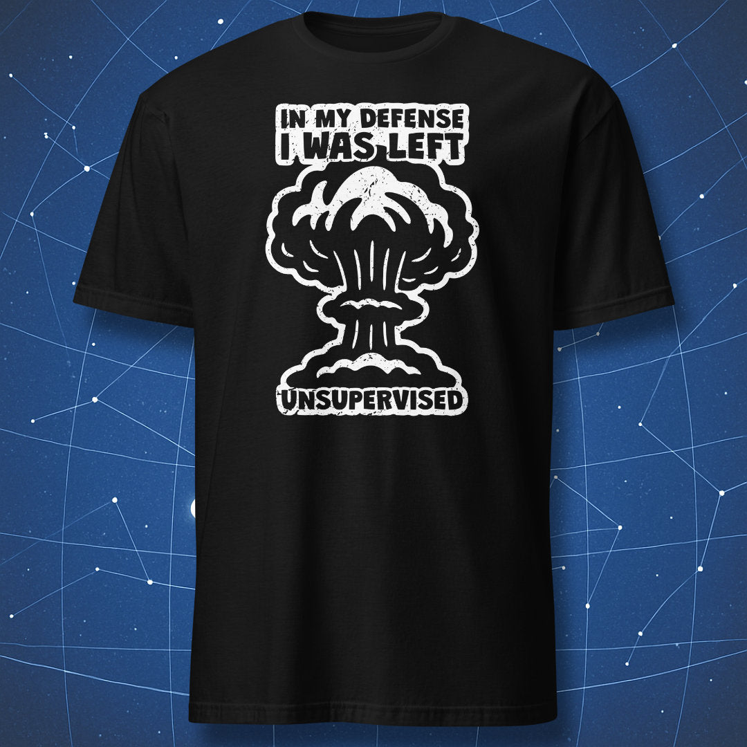 funny science T-shirt on black fabric with white explosion graphic and text “In My Defense I Was Left Unsupervised”