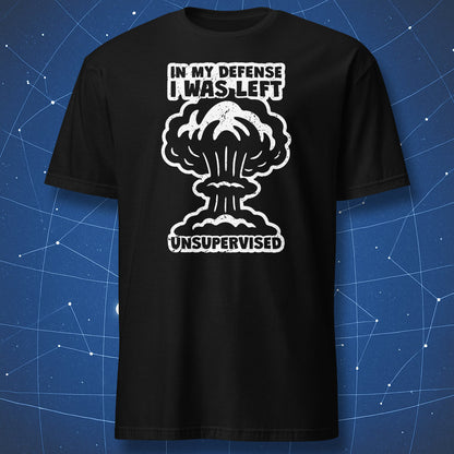 funny science T-shirt on black fabric with white explosion graphic and text “In My Defense I Was Left Unsupervised”