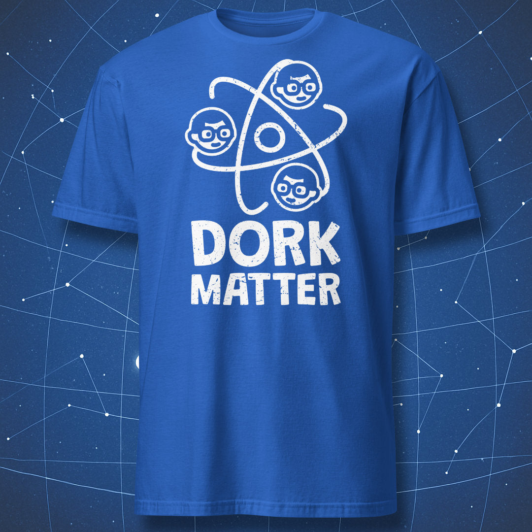 funny nerd pun T-shirt on royal blue fabric with white atom and cartoon faces titled “Dork Matter”