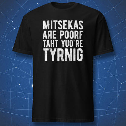 funny typo motivation T-shirt on black fabric with white text “Mitsekas are poorf taht yuo’re tyrnig” in bold distressed letters