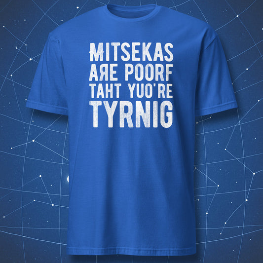 funny learning T-shirt on royal blue fabric featuring intentionally misspelled phrase “Mitsekas are poorf taht yuo’re tyrnig”