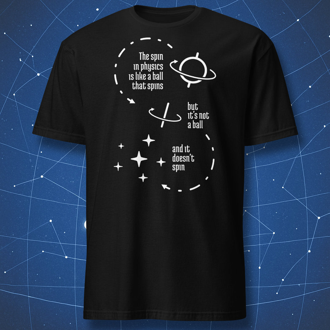 funny physics T-shirt on black fabric showing white orbit-like diagrams with text “The spin in physics is like a ball that spins but it’s not a ball and it doesn’t spin”