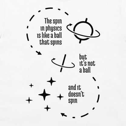 A white t-shirt featuring a black graphic print with text and illustrations related to physics spin concepts, including 'The spin in physics is like a ball that spins', 'but it's not a ball', and 'and it doesn't spin'.