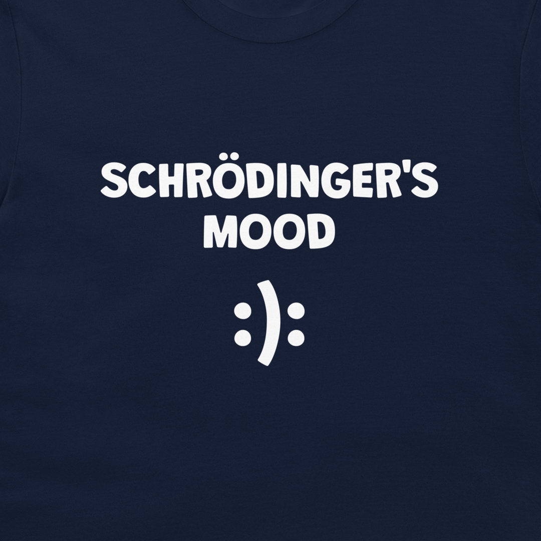 A close-up of a navy blue t-shirt featuring the white printed text 'SCHRÖDINGER'S MOOD' and a white smiley face symbol.