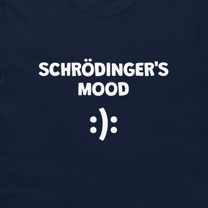 A close-up of a navy blue t-shirt featuring the white printed text 'SCHRÖDINGER'S MOOD' and a white smiley face symbol.