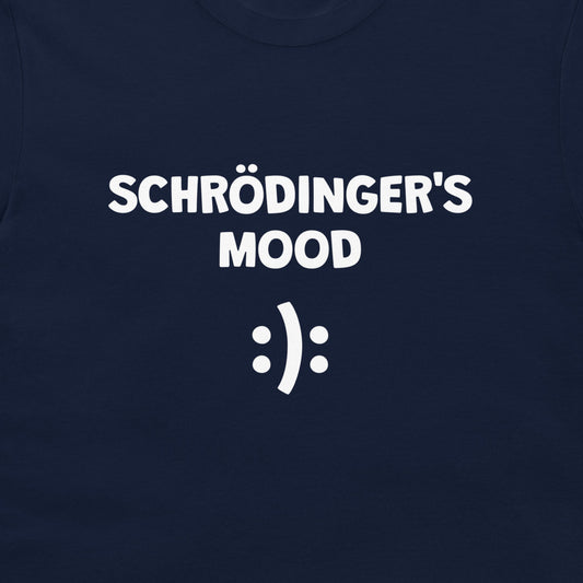 A close-up of a navy blue t-shirt featuring the white printed text 'SCHRÖDINGER'S MOOD' and a white smiley face symbol.