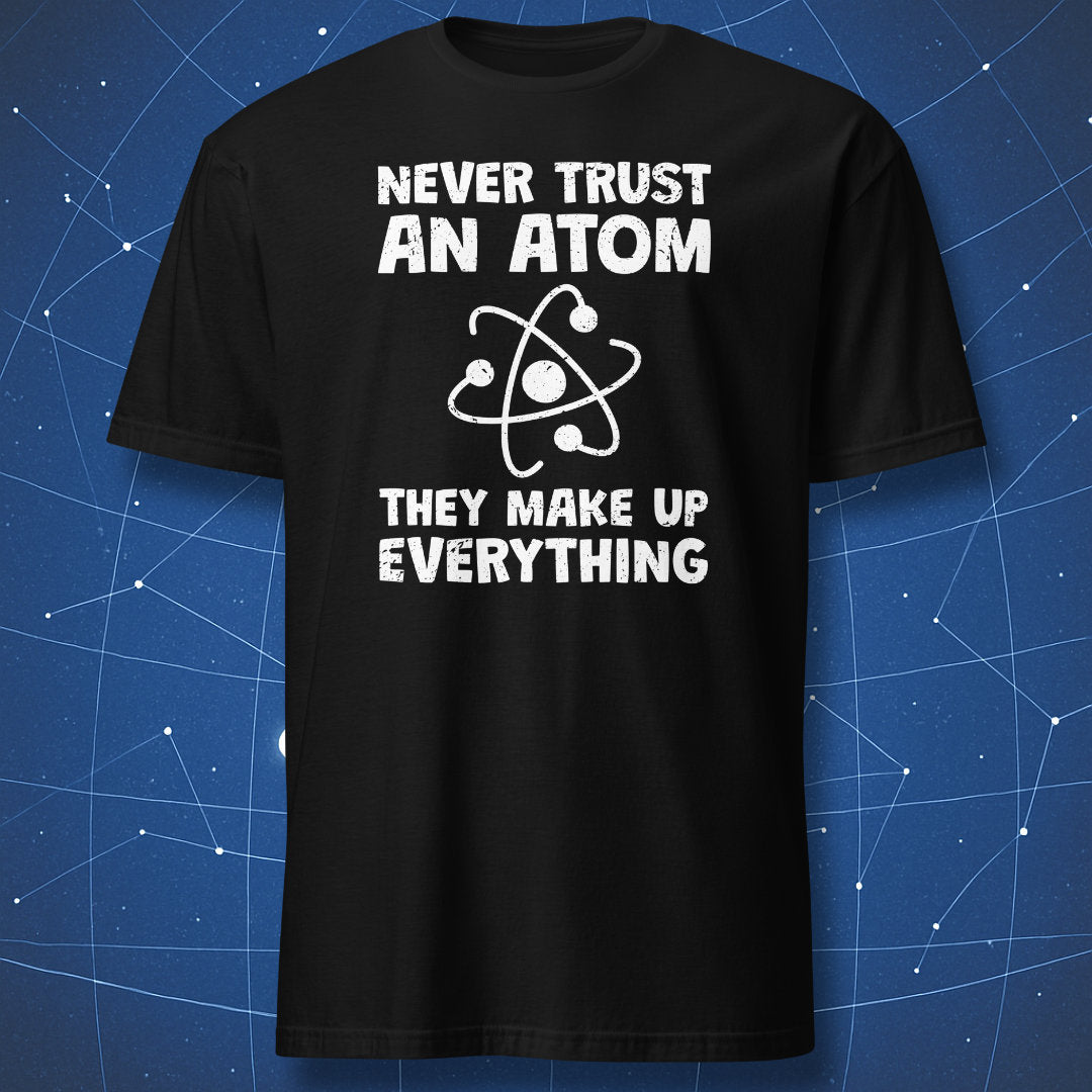funny science T-shirt on black fabric with atom graphic and text Never Trust an Atom They Make Up Everything