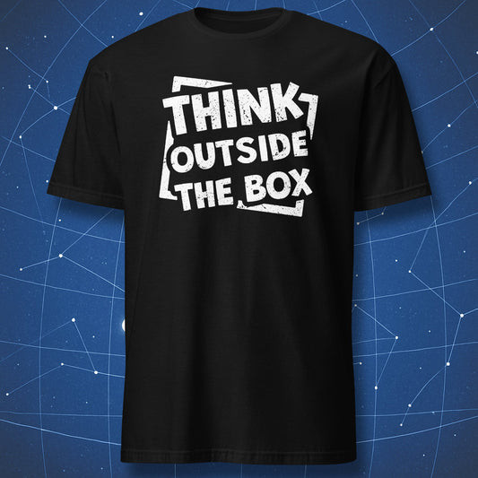 creative thinking T-shirt on black fabric with distressed white text reading Think Outside the Box in tilted layout breaking the frame