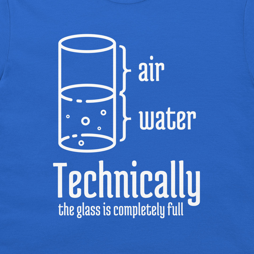 A close-up of a blue t-shirt featuring a white graphic print of a glass with bubbles, labeled 'air' and 'water' with the text 'Technically the glass is completely full'.