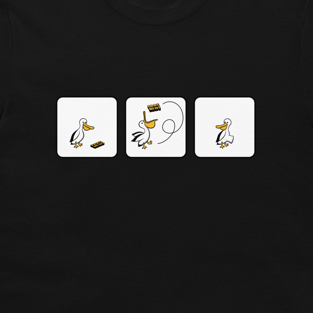 A close-up of a black t-shirt featuring a graphic print of three white square panels with a cartoon pelican and fake news.