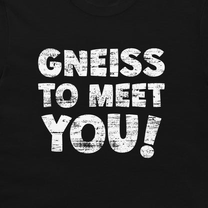 A close-up of a black garment, likely a t-shirt, featuring a distressed white graphic print that reads 'GNEISS TO MEET YOU!'.