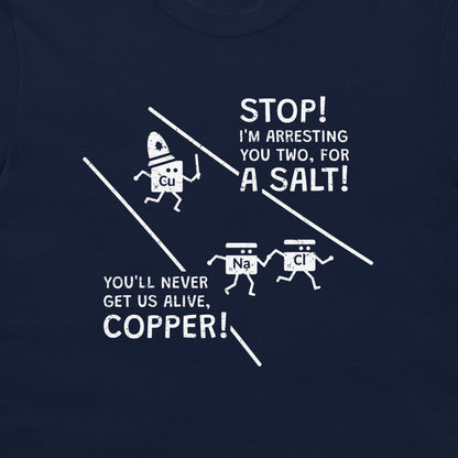 A close-up of a navy blue t-shirt featuring a white graphic print with cartoon characters and text that reads 'STOP! I'M ARRESTING YOU TWO, FOR A SALT! YOU'LL NEVER GET US ALIVE, COPPER!'.