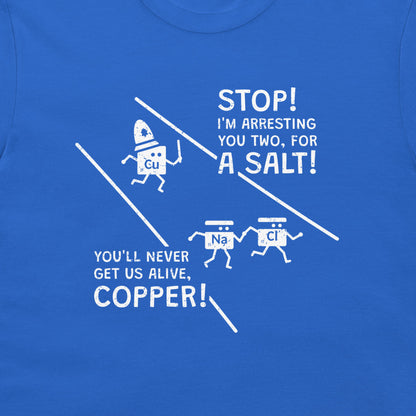 A close-up of a blue t-shirt featuring a white graphic print with cartoon ions and the text 'STOP! I'M ARRESTING YOU TWO, FOR A SALT! YOU'LL NEVER GET US ALIVE, COPPER!'.