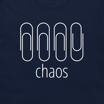 A close-up of a navy blue t-shirt featuring a white graphic of four paperclip-like shapes above the word 'chaos' in lowercase sans-serif font.