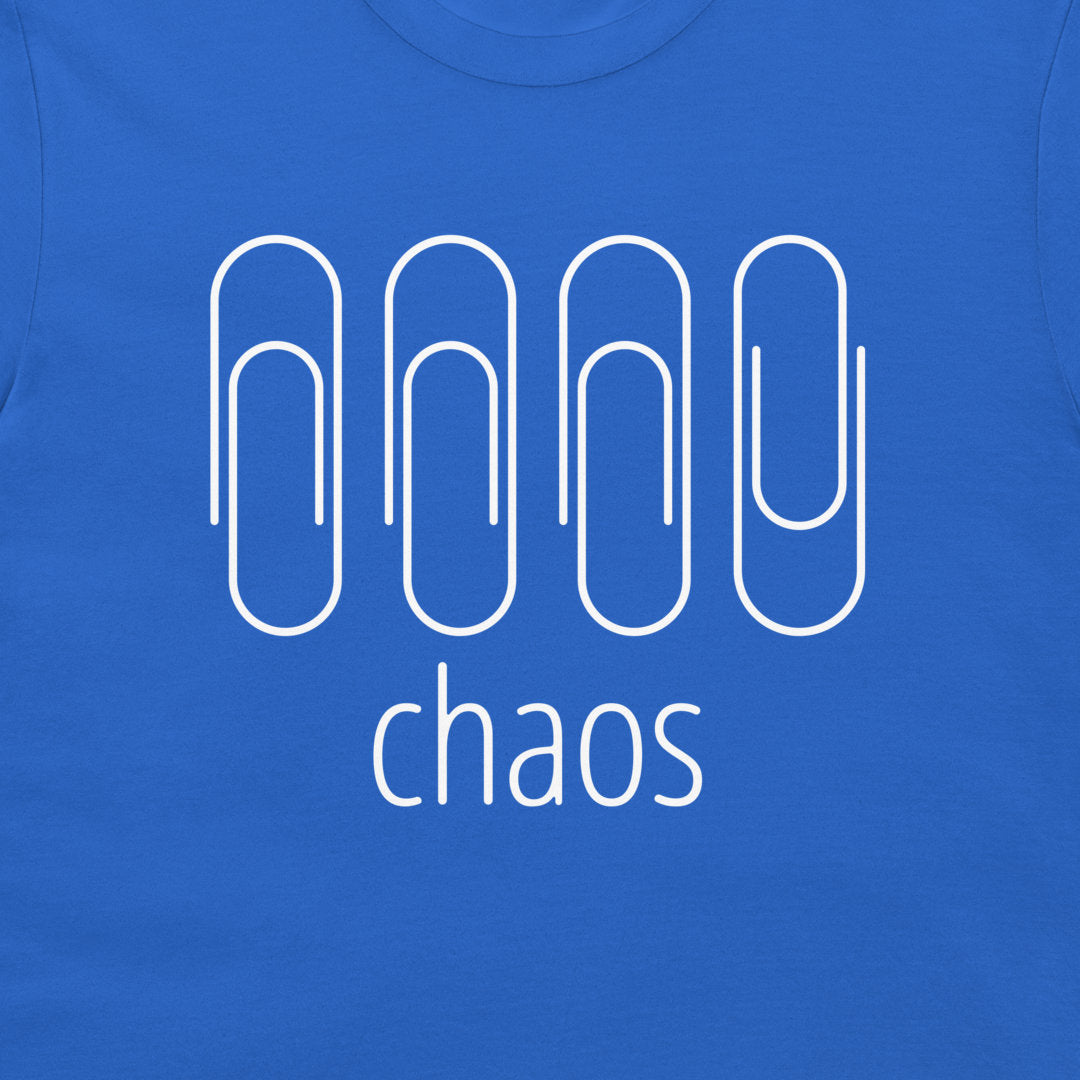 A close-up of a royal blue t-shirt featuring a white graphic of four stylized paperclip-like shapes above the word 'chaos' in lowercase sans-serif font.