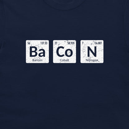 A close-up of a navy blue t-shirt featuring a graphic print of three white periodic table style tiles spelling out 'BaCoN' with the words 'Barium', 'Cobalt', and 'Nitrogen' underneath.
