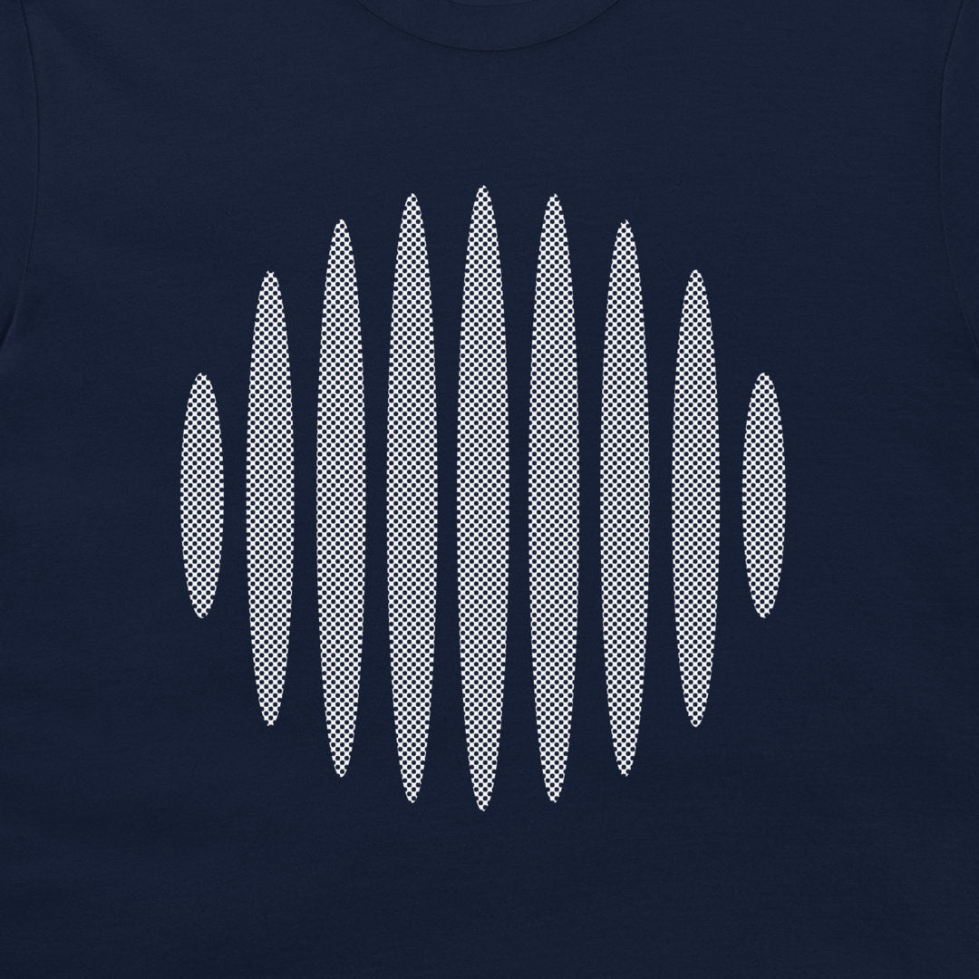 A close-up of a navy blue garment, likely a t-shirt, featuring a graphic print of eight vertical surfboards arranged in a wavy, soundwave-like pattern in a white and black halftone dot design.