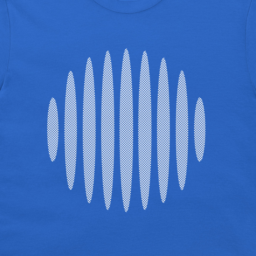 A close-up of a royal blue garment, likely a t-shirt, featuring a white halftone oval graphic pattern across the chest.