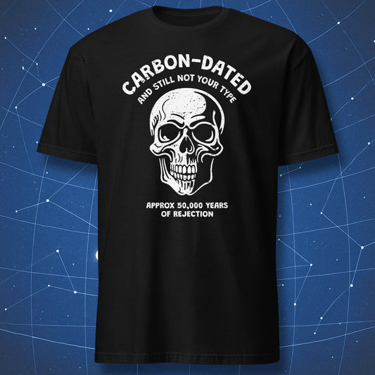 funny archaeology T-shirt on black fabric with skull illustration and text “Carbon-dated and still not your type – approx 50,000 years of rejection”