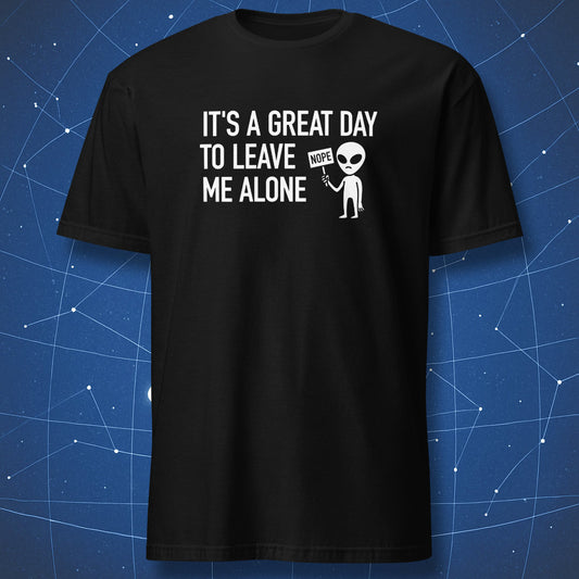 funny alien T-shirt on black fabric with text “It’s a great day to leave me alone” and cartoon alien holding a sign that says “NOPE”