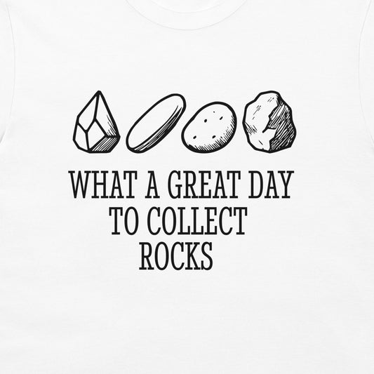 White t-shirt featuring a black graphic print of four different rocks and the text 'WHAT A GREAT DAY TO COLLECT ROCKS'.