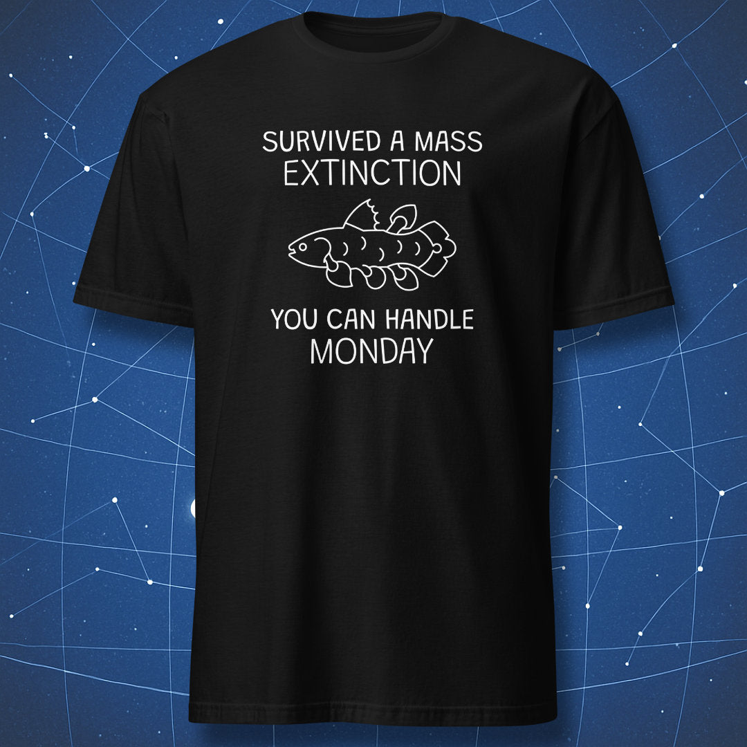 funny paleontology T-shirt on black fabric showing white text “Survived a Mass Extinction You Can Handle Monday” with a coelacanth fish illustration