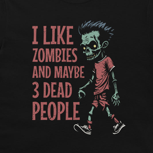 A black graphic t-shirt featuring a cartoon zombie walking next to the text 'I LIKE ZOMBIES AND MAYBE 3 DEAD PEOPLE' in a distressed red font.
