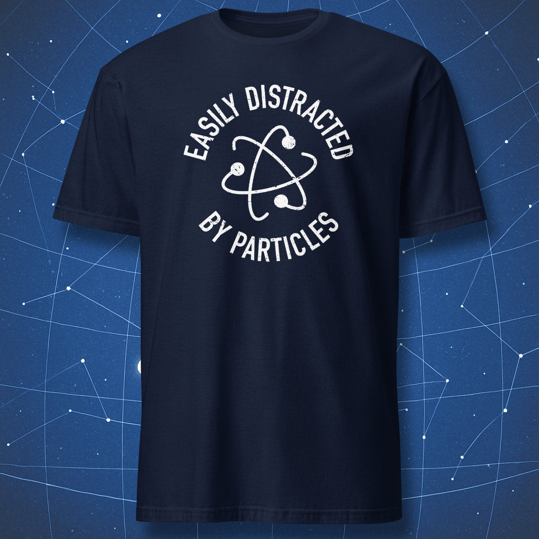 Navy T-shirt with white atom design and phrase “Easily Distracted by Particles.”