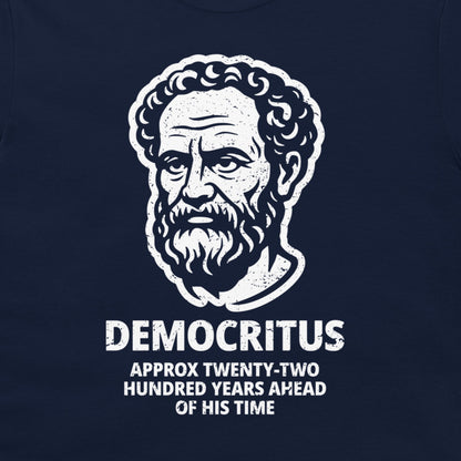 A close-up of a navy blue t-shirt featuring a white distressed graphic of Democritus' portrait with the text 'DEMOCRITUS APPROX TWENTY-TWO HUNDRED YEARS AHEAD OF HIS TIME'.