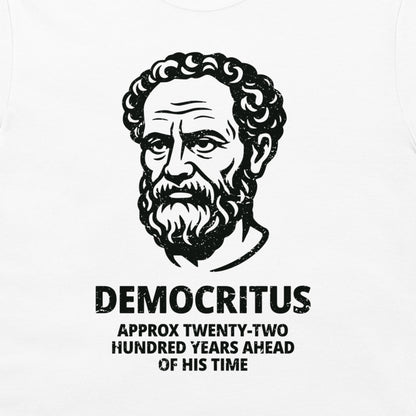 A white t-shirt featuring a black graphic print of a classical portrait of Democritus with the text 'DEMOCRITUS APPROX TWENTY-TWO HUNDRED YEARS AHEAD OF HIS TIME' printed below.