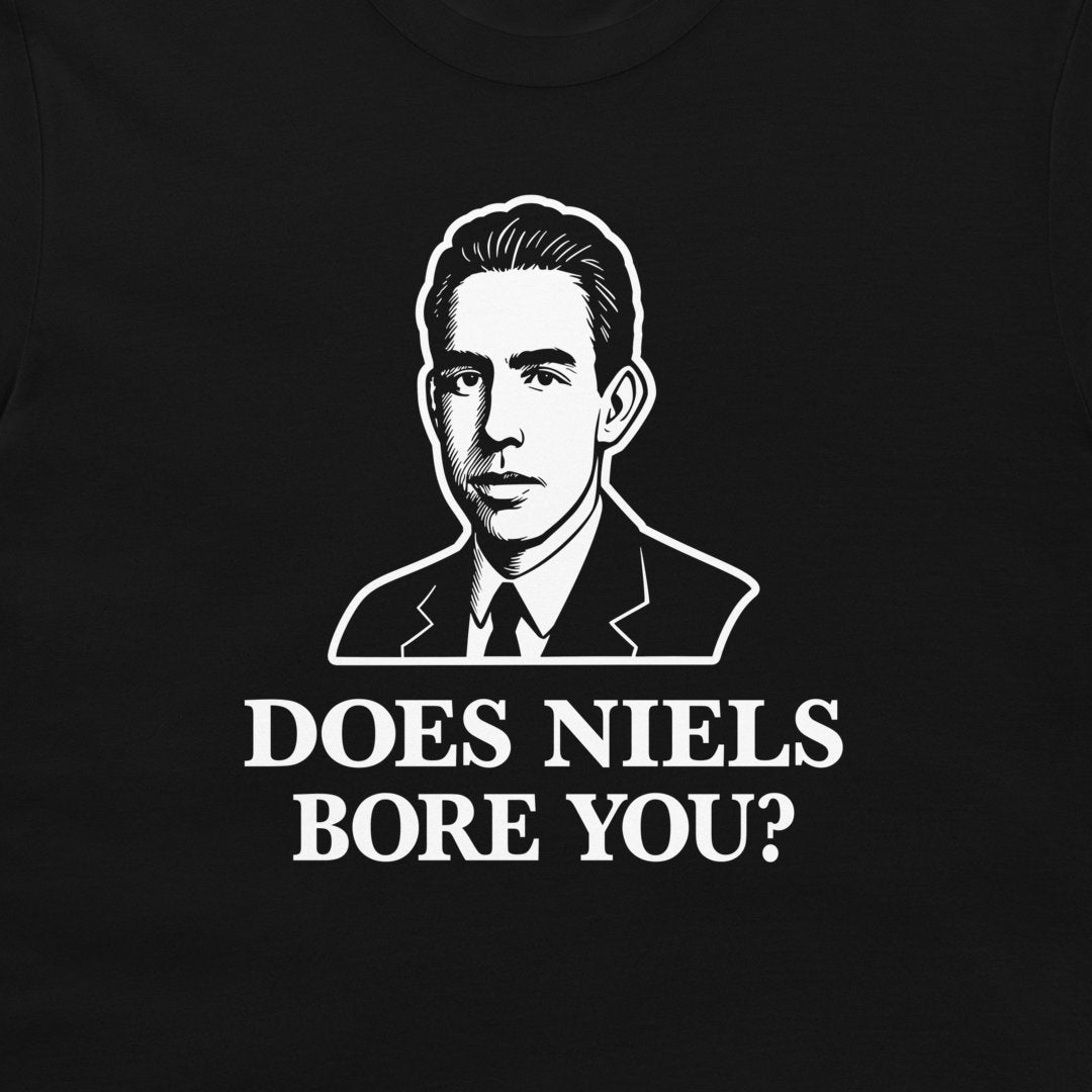 A close-up of a black t-shirt featuring a white graphic print of a man in a suit and the text 'DOES NIELS BORE YOU?' in bold white capital letters.
