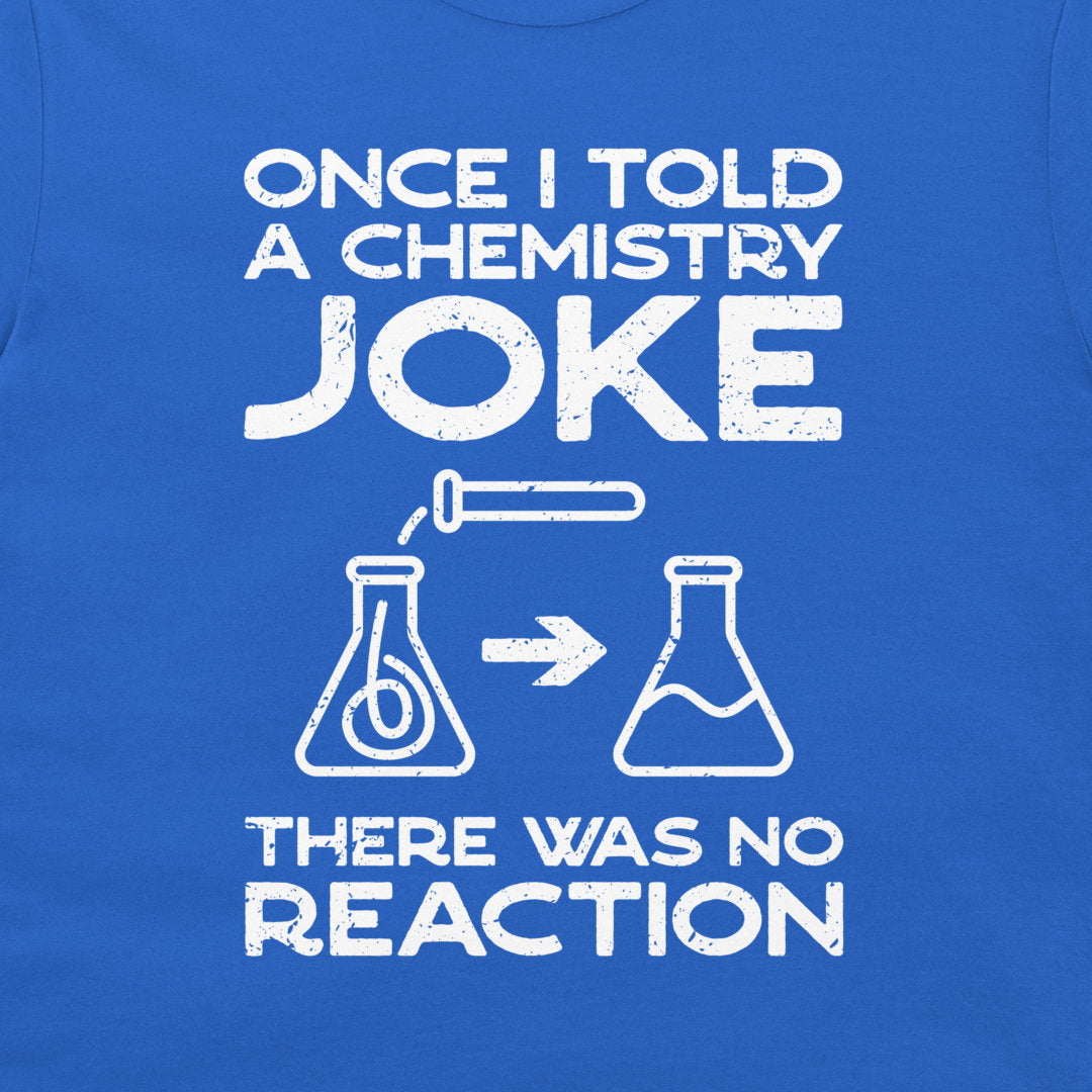 A close-up of a blue T-shirt with a white distressed graphic print that reads 'ONCE I TOLD A CHEMISTRY JOKE THERE WAS NO REACTION' with simple flask illustrations.