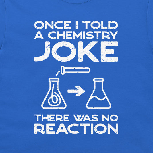 A close-up of a blue T-shirt with a white distressed graphic print that reads 'ONCE I TOLD A CHEMISTRY JOKE THERE WAS NO REACTION' with simple flask illustrations.