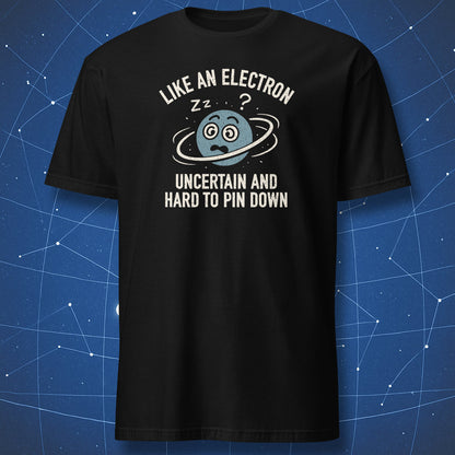 Black T-shirt with cartoon electron surrounded by orbit rings and text “Like an electron – uncertain and hard to pin down.” Funny science humor shirt.
